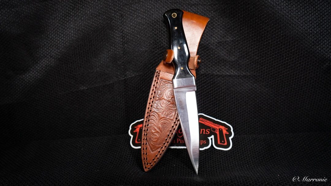 Custom engraved black-handle knife by Castillo and Sons
