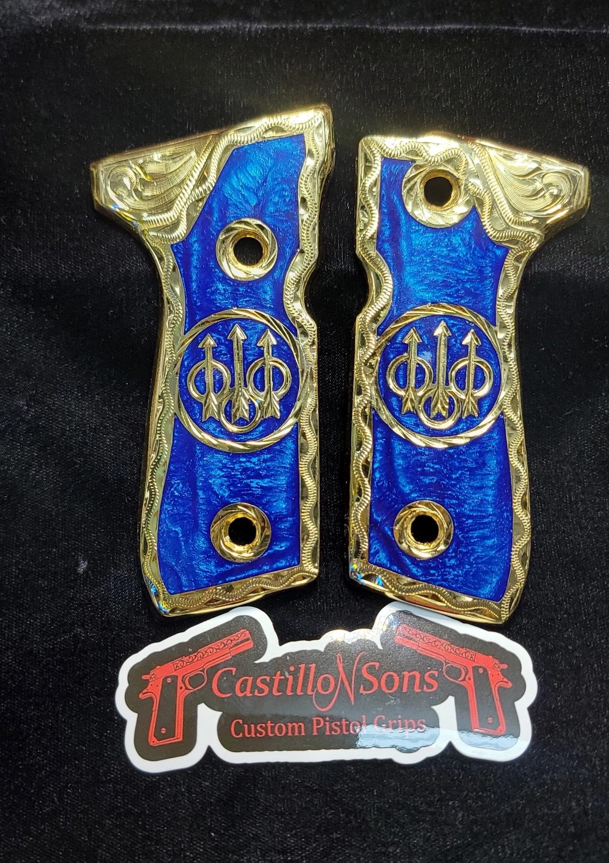 Gold Beretta custom grips with blue resin